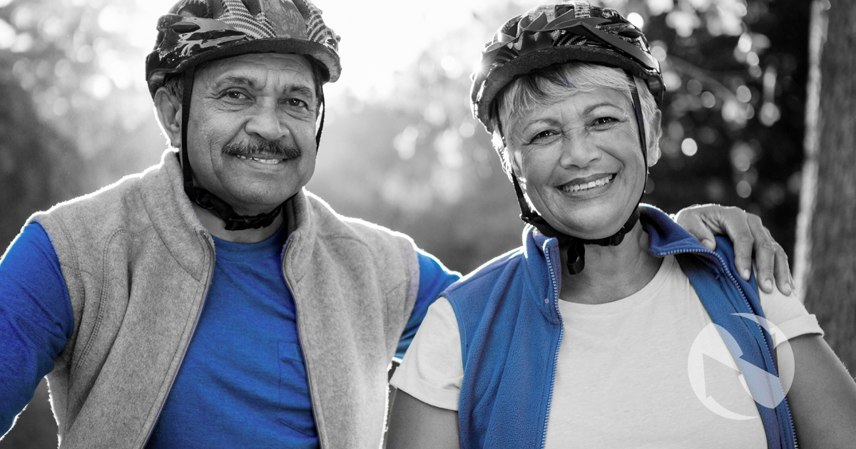A retired woman enjoys a day biking at the beach, confident that her financial strategy means she won't outlast her money.