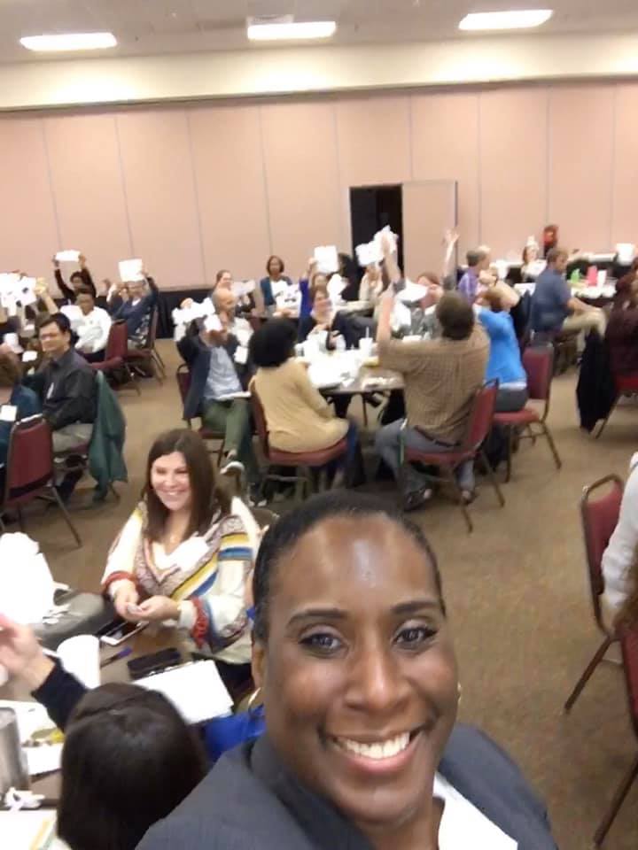 Dr. Nic speaking at a leadership event